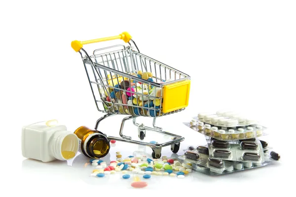 Shopping trolley with pills isolated on white background — Stock Photo, Image