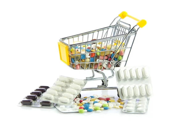 Carrello shopping con pillole isolate su sfondo bianco — Foto Stock