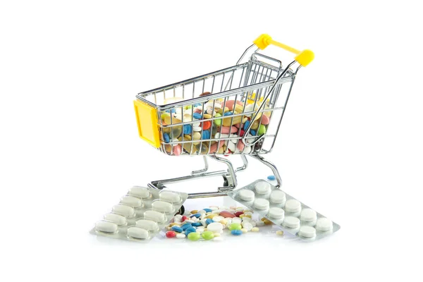 Carrello shopping con pillole isolate su sfondo bianco — Foto Stock