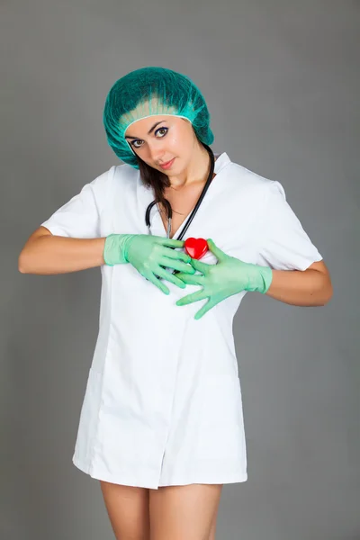 Woman doctor on grey background — Stock Photo, Image