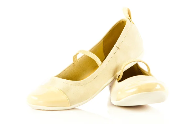 Обувь для девочек на белом фоне — стоковое фото