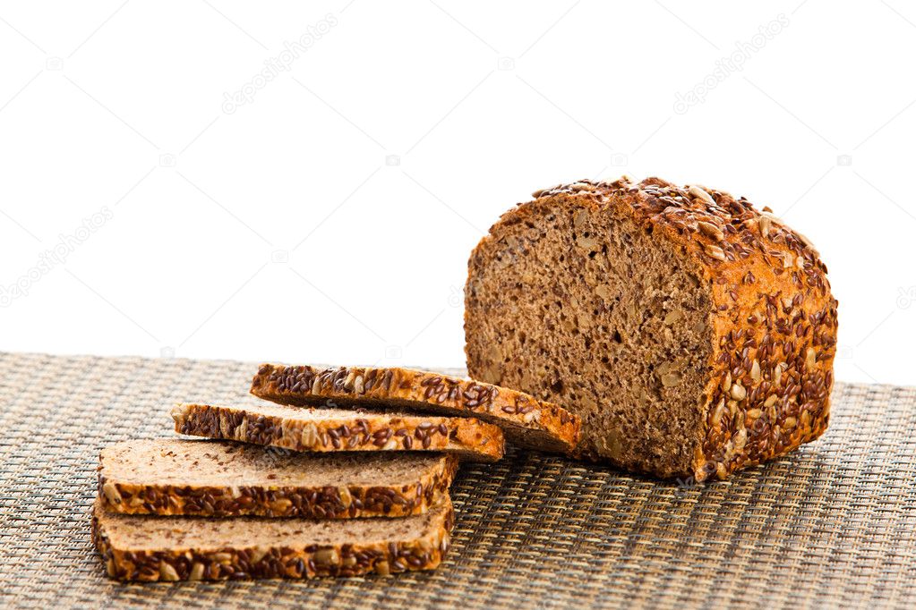 Brown seed biobread isolated on white background