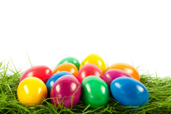 Easter eggs in busket on green gras isolated — Stock Photo, Image