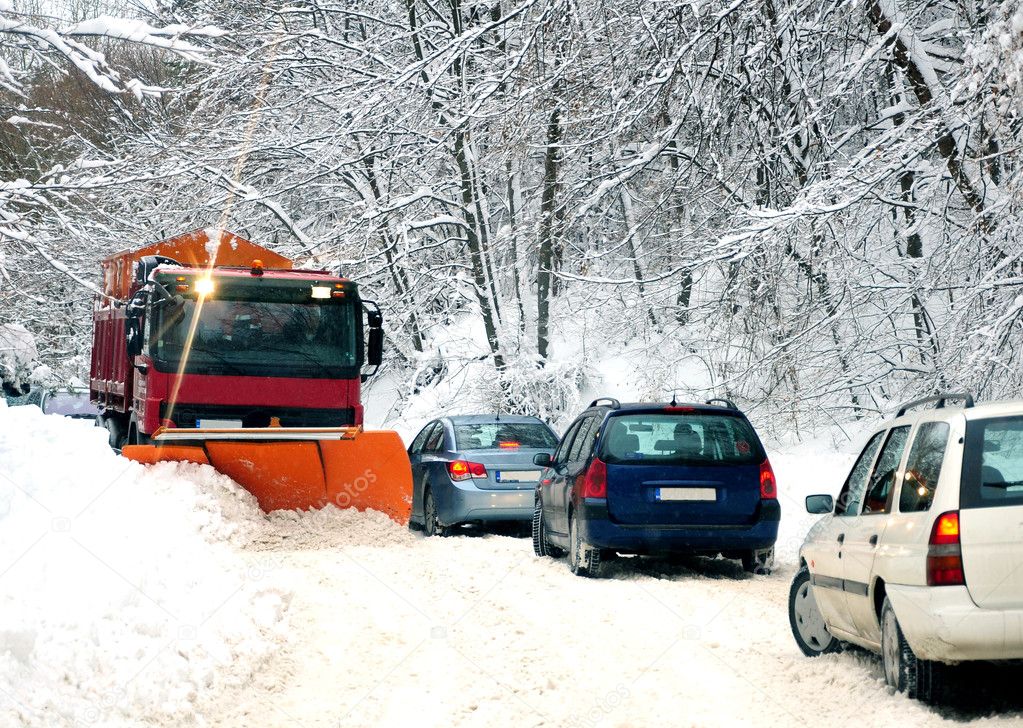 snow plow cleaning the road