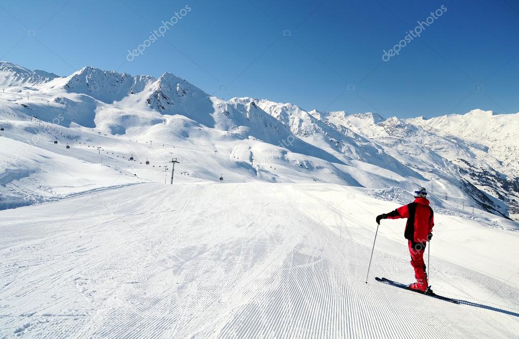 male skier enjoying mountain view