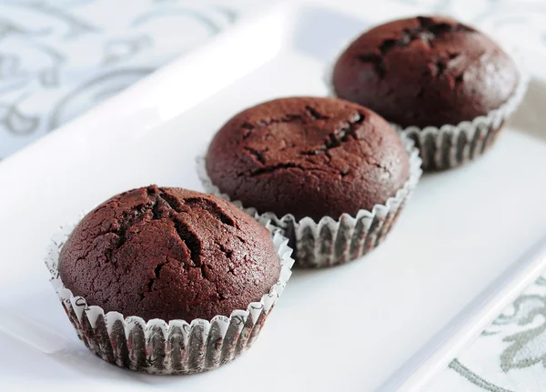 Freshly baked chocolate muffins — Stock Photo, Image