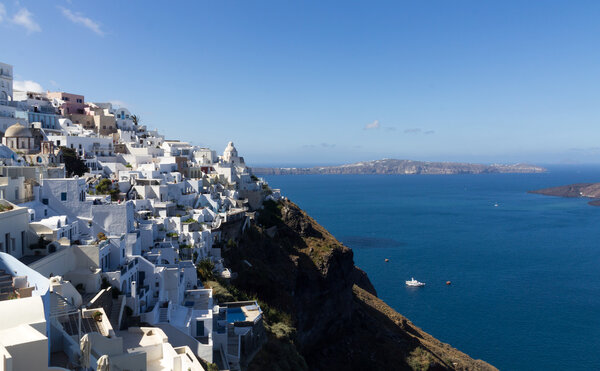 Fira panorama with caldera view and Nea Kameni, Santorini, Greece