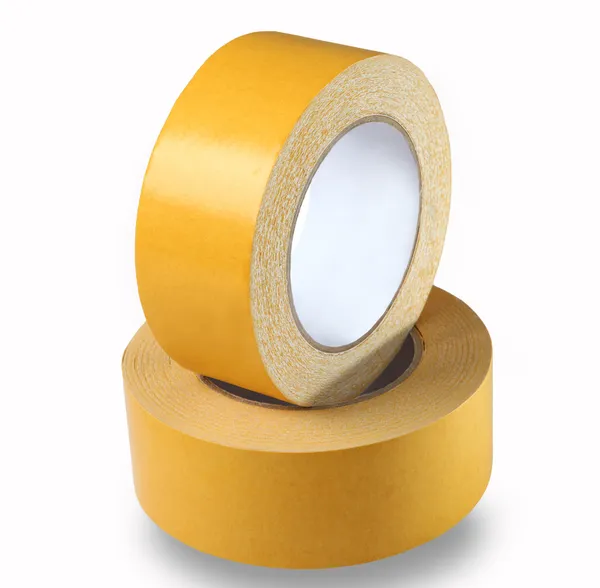 Two rolls of yellow double-sided tape on a white background, iso — Stock Photo, Image