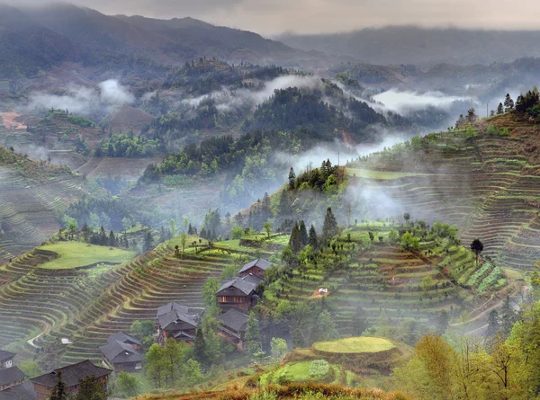 Spring landscape with village and rice terraces, mountain rural China. — Stock Fotó