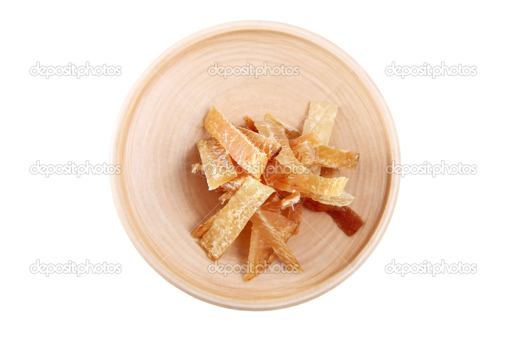 Wooden plate with dried fish, isolated image on white background