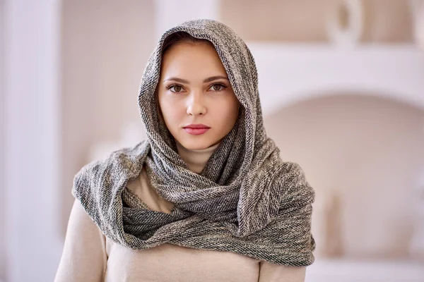 Portrait of young woman with headscarf at home. — Stock Photo, Image