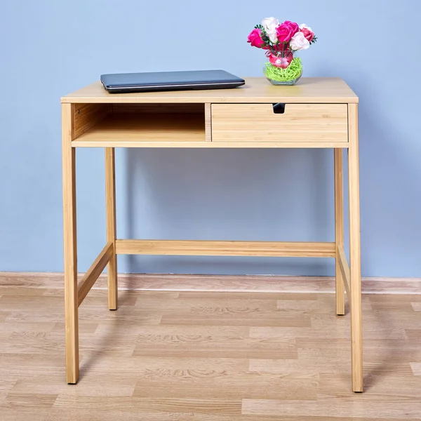 Console table with storage and laptop is standing at home. — Stock Photo, Image