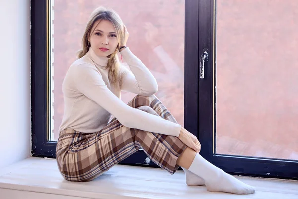 Checkered Pants Young Woman Who Sitting Windowsill Serious Look Indoors — Stock Photo, Image