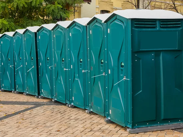 Row Green Mobile City Toilets Royalty Free Stock Images