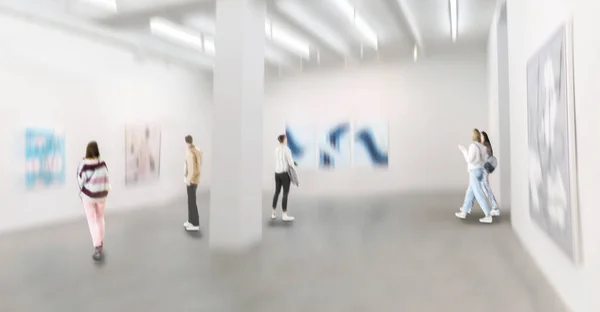 Abstract image of people in the lobby of modern art center with a blurred background