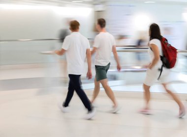 Abstract image of people in motion with blurred background