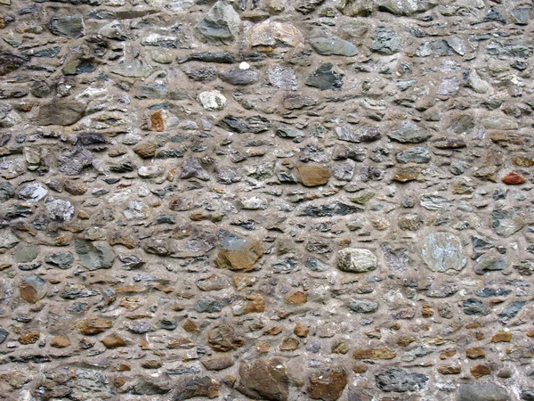 Irregular Marrom Áspero Pedra Parede Fundo Com Cimento Entre Rochas — Fotografia de Stock