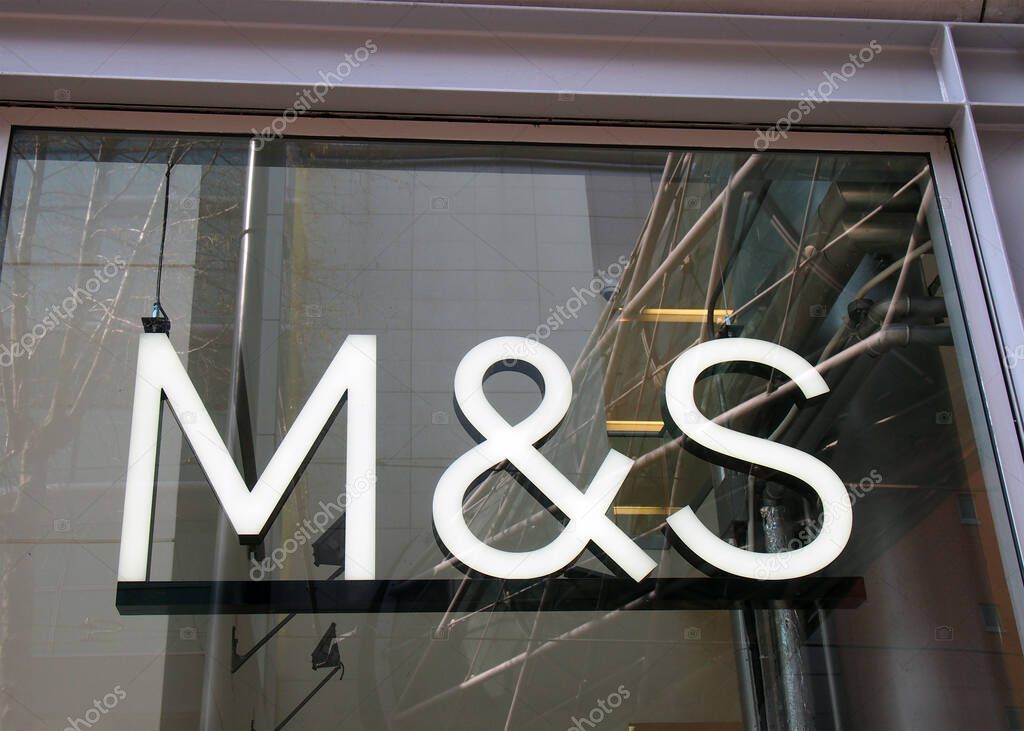 Manchester, united kingdom - 24 march 2022: sign above a branch of a marks and spencer store in manchester city centre