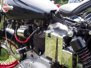 hebden bridge, west, yorkshire, united kingdom - 7 August 2022: close up of the engine and tank of a black vintage harley davidson motorcycle at hebden bridge vintage weekend