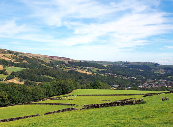 view of the calder valley in calderdale west yorkshire with the village of mytholmroyd visible in the distance