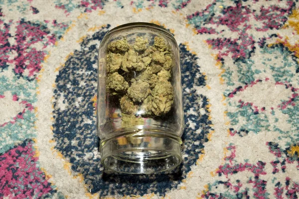 Marijuana Buds Glass Jar Background Close – stockfoto