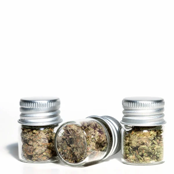 Closeup Marijuana Buds Glass Jars Isolated White Background — Φωτογραφία Αρχείου