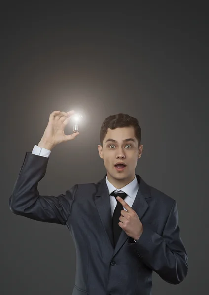 Man holding a lamp — Stock Photo, Image