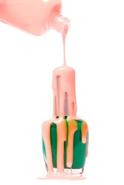 Pink paint dripping on the green — Stock Photo, Image