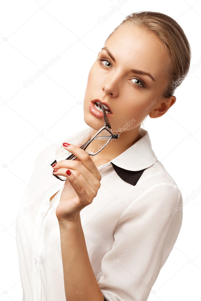 girl in a business suit bites spectacles