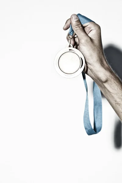 Medal in hand — Stock Photo, Image