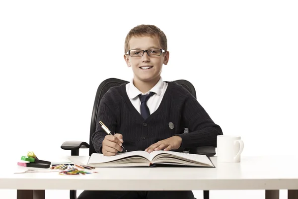 Boy writes in a notebook — Stock Photo, Image