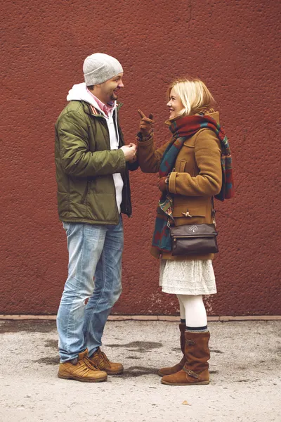 Two young people talking and discussing.