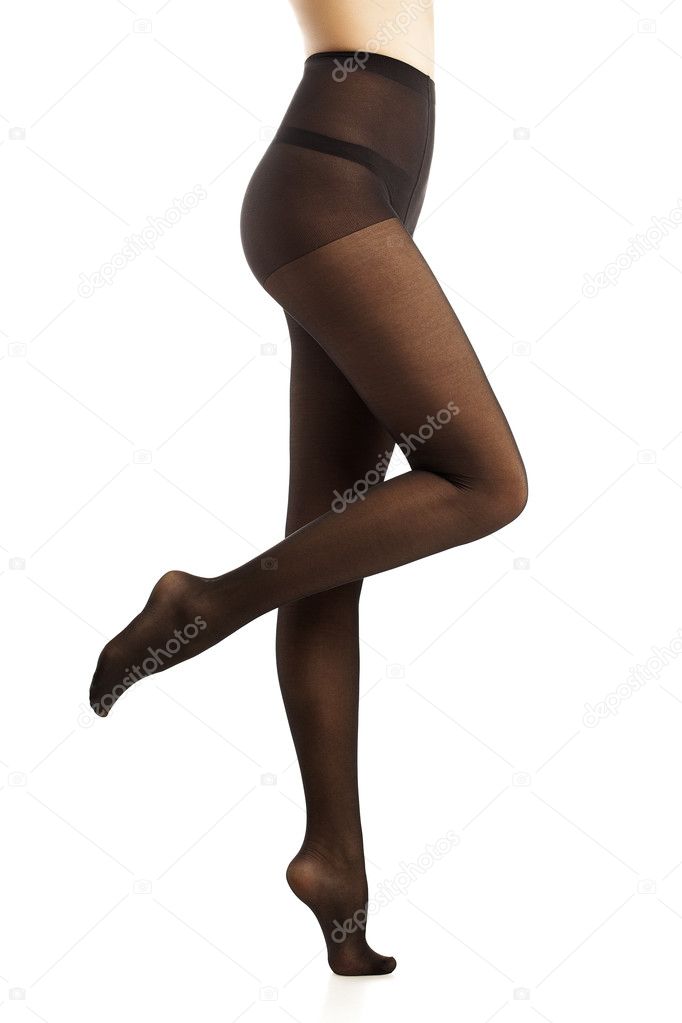 Beautiful girl in black pantyhose. Isolated. White background.