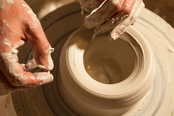 Hands working on pottery wheel , close up — Stock Photo, Image