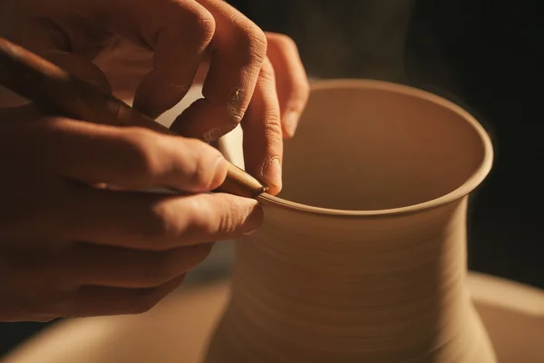 Hands working on pottery wheel , retro style toned — Stock Photo, Image