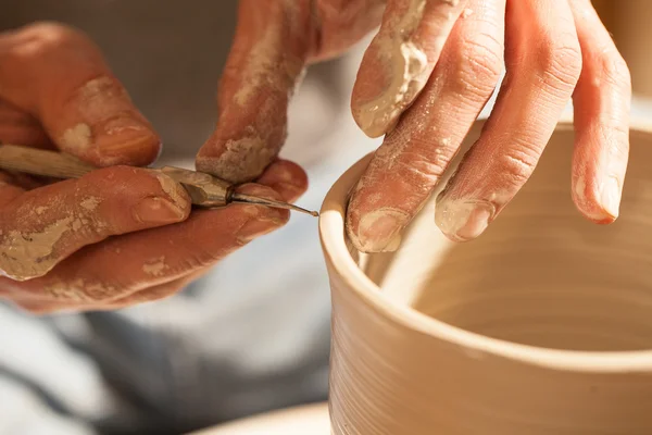 Hands working on pottery wheel ,retro style — Stock Photo, Image