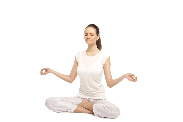 Beautiful girl is engaged in yoga — Stock Photo, Image