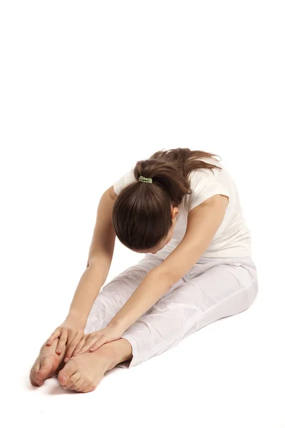 Beautiful girl is engaged in yoga — Stock Photo, Image