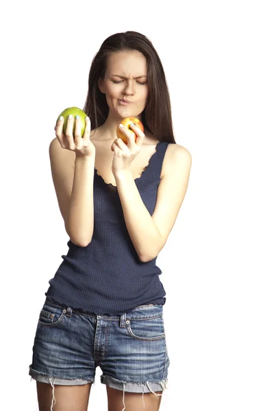 Mujer sonriente con manzana en blanco Imágenes de stock libres de derechos