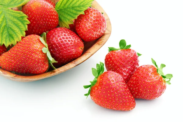 Strawberries in wooden plate — Stock Photo, Image