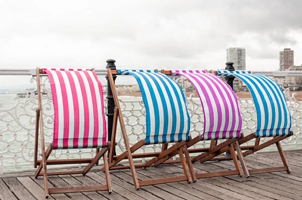 Colorful sunbeds at the seaside
