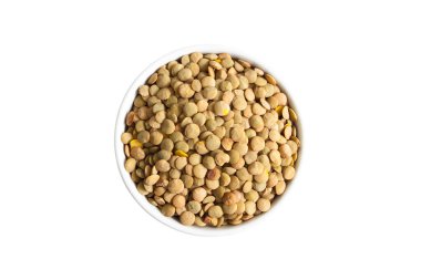 Brown lentils in a cup from above isolated on white background