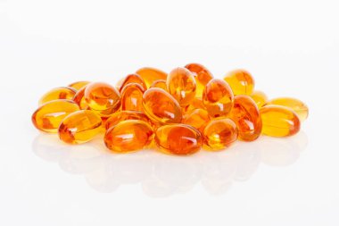 Vitamin D supplement isolated on white background