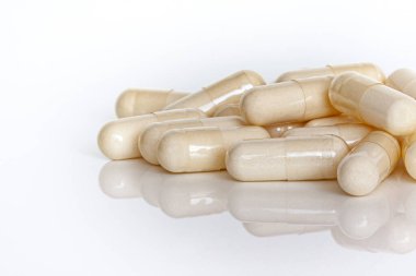 A pile of vitamin capsules