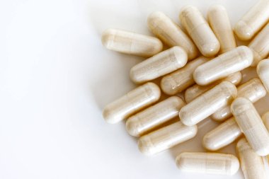 A pile of vitamin capsules isolation