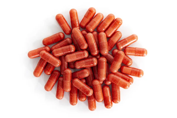 Pile Red Vitamin Capsules Rechtenvrije Stockafbeeldingen