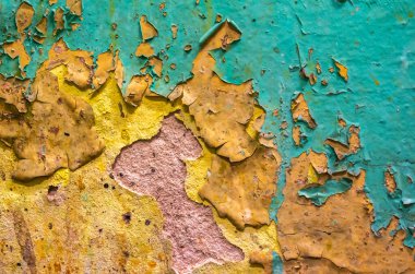 Turuncu ve mavi boyalı eski duvar soyuluyor. arkaplan veya doku