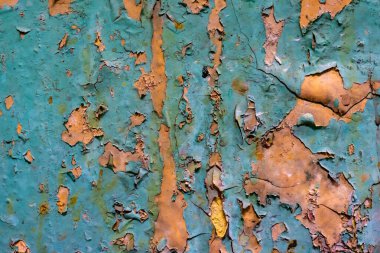 Turuncu ve mavi boyalı eski duvar soyuluyor. arkaplan veya doku