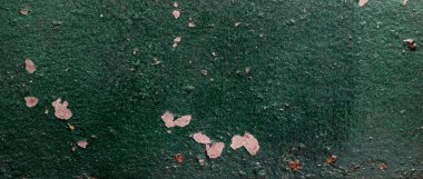 Yeşil boyayla boyanmış eski bir duvar. arkaplan