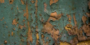 Turuncu ve mavi boyalı eski duvar soyuluyor. arkaplan veya doku